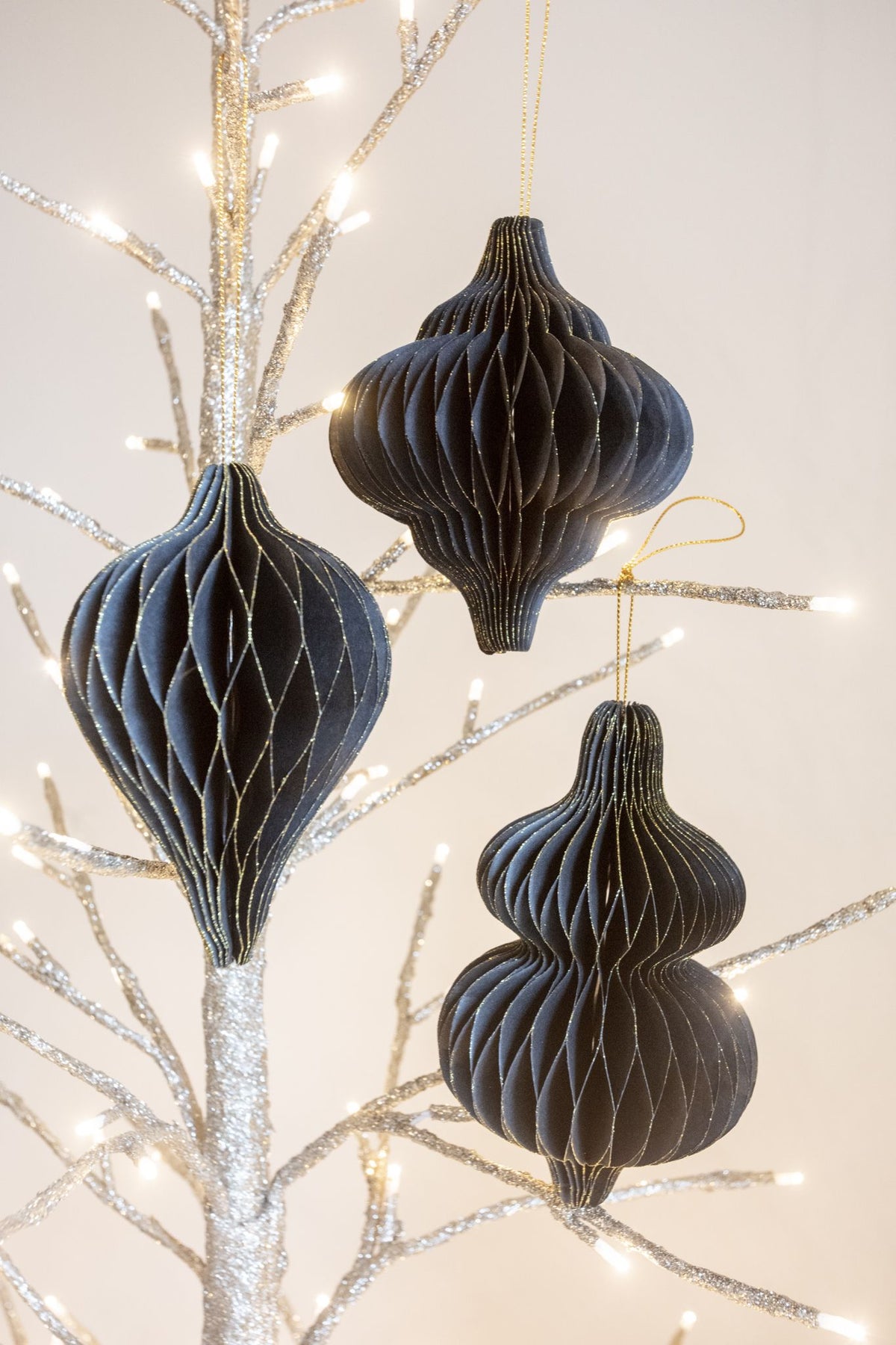 Set of 3 Black and Gold Hanging Paper Decorations.